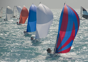 J/70 class boats under spinnaker during a day of racing during the 2017 regatta. 